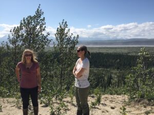 two women standing in front of the magnificent Delta River Valley in Alaska